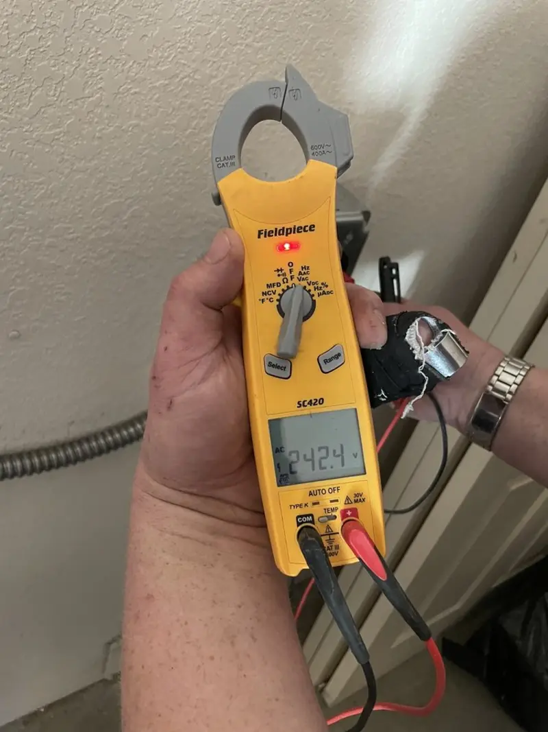 Voltage testing with clamp meter during Electrical Installation Services in Prairieville